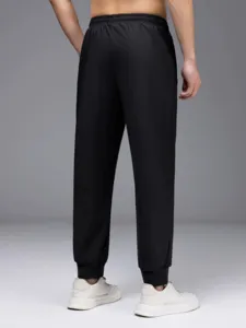 Men's black quick dry casual sport pants with elastic cuffed design for active outdoor daily wear.