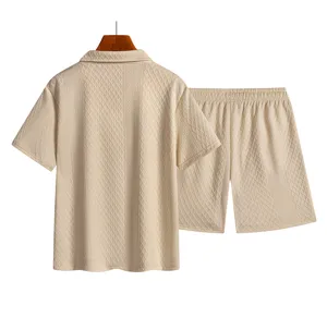 Close-up detail of mens summer beige textured polo shirt and shorts set breathable fabric.