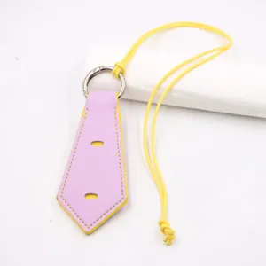 Detailed view of the purple leather tie-shaped glasses strap with yellow edges for use.