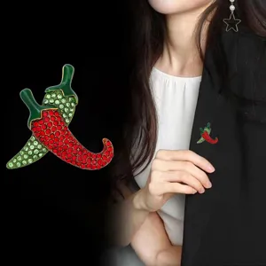 Rhinestone chili pepper brooch detailed view, fashion alloy lapel pin for suits and coats.