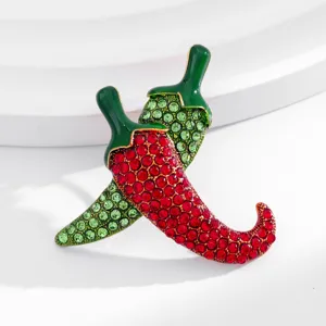 Sparkling rhinestone chili pepper brooch detail, featuring vibrant red and green crystal alloy pin.