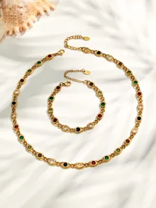 Close-up detail shot of 18k gold plated stainless steel colorful zircon necklace and bracelet set.