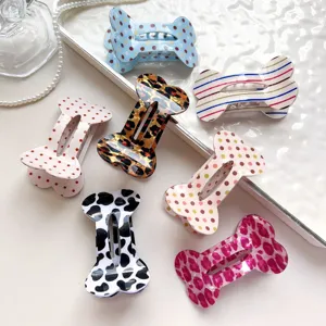 Leuke haarklemmen in botvorm met retro prints zoals luipaardprint en stippen voor dames.