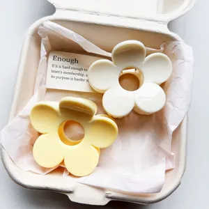 Exquisite floral hair claw detail showing dual white and yellow PC shark clips in a gift box.
