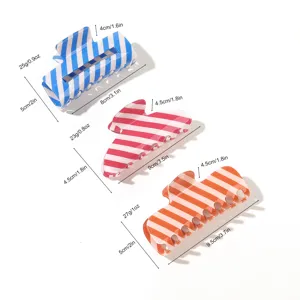 Colorful striped PVC hair claw detail, summer fresh style hair clip showcasing size and weight.