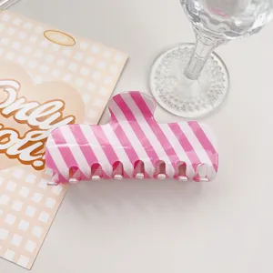Pink white striped PVC hair claw clip, stylish summer hair accessory for daily wear.