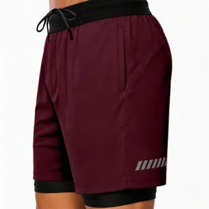 Men's athletic running shorts detail, breathable double-layer design with elastic waistband for fitness workout.
