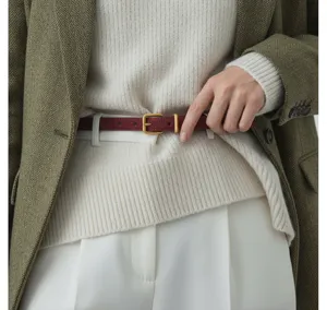 Detailed shot of a burgundy suede women belt with metal buckle, styled for daily winter outfits.