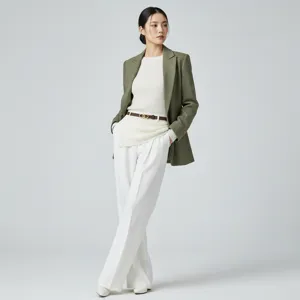 Elegant women belt styled with olive blazer and white trousers in professional studio detail.