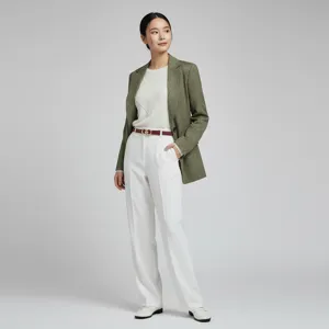 Detailed view of a model showcasing a stylish green blazer, white trousers and a chic leather belt.