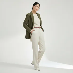 Detailed view of the women's retro suede leather belt worn with professional commute outfit.