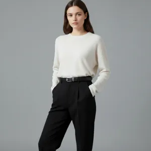 Minimalist women leather belt with stylish black trousers and white knit sweater for daily wear.