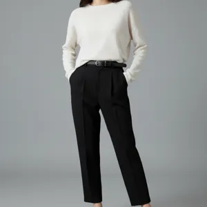 Elegant minimalist women's leather belt detail shot showcasing sleek black design and silver buckle.