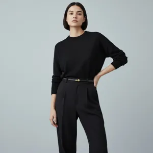 Women's thin leather belt featuring a chic gold sphere buckle, elegant and versatile style.