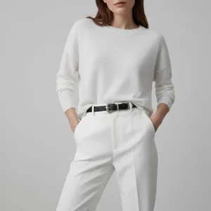 Western style black leather belt detail featuring an intricate silver buckle for women.