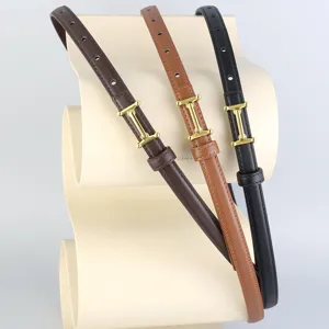 Slim genuine leather women belt with golden metal buckle, minimalist versatile design.