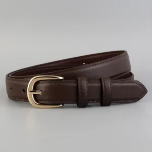Stylish leather women's belt with gold buckle, minimalist fashion accessory for trousers.