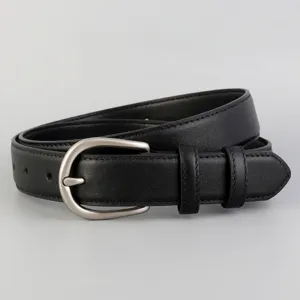 Detailed view of women's genuine leather belt, classic black design with silver buckle.