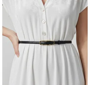 Close-up view of a sleek black leather belt featuring a chic gold oval buckle for women.