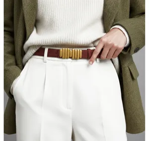 Stylish women's red belt with unique gold vertical bar metal buckle for daily wear outfits.