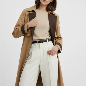 Leather belt detail view paired with trench coat and trousers for women outfit style