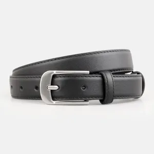 Close-up of a stylish black leather women's belt with a sleek silver buckle for casual jeans.