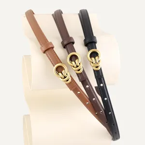 Women's slim leather belt with elegant interlocking metal buckle, perfect for dresses and coats.