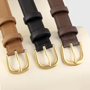 Detailed view of women's leather belt close up showing fine stitching and metal buckle.