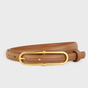 Minimalist brown leather belt featuring a sleek gold-toned oblong metal buckle detail.