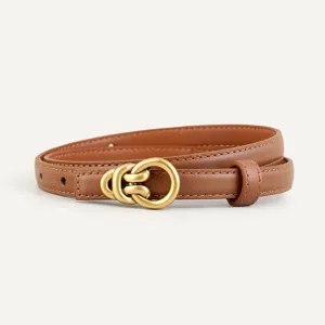 Close-up detail shot of a brown leather women belt featuring a vintage gold-toned metal buckle.