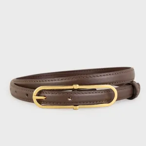 Close-up detail of a women's brown leather belt with a sleek gold-tone oval metal buckle.