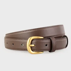 Detailed close-up of brown genuine leather women's belt featuring a classic gold metal buckle.