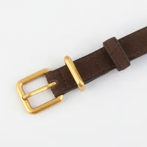 Retro cow suede belt detail view showcasing frosted brown finish and gold metal buckle.