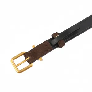 Retro cow suede women belt detail shot, featuring black strap and gold buckle.