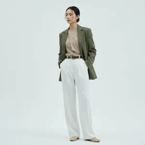 Detail view of the elegant brown leather belt styling, showcasing modern fashion design.
