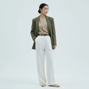 Detail shot of a women's brown leather belt paired with chic outfit for daily wear.