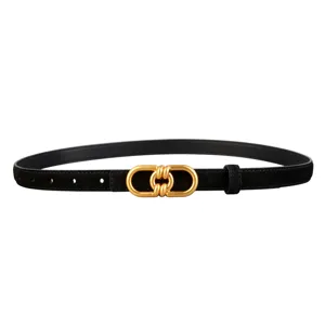 Close-up detail of a black suede belt featuring a stylish gold-toned metal knotted buckle.