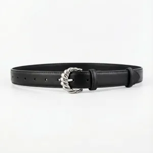 Detailed view of women black leather belt with stylish silver twisted metal buckle accessory.