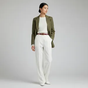 Burgundy leather belt worn with olive green blazer and white trousers in a professional studio shot.