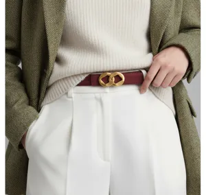Elegant women's leather belt with gold-tone buckle, perfect detail shot for stylish outfits.