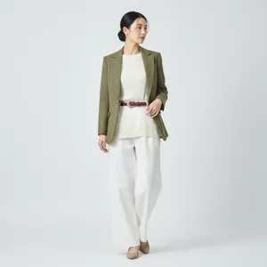 Detailed shot of women's genuine leather belt styled with casual blazer and trousers.