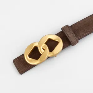 Detail view of brown suede women's belt featuring an elegant gold geometric buckle design.