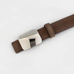 Close-up detail of brown suede women belt with a sleek metallic square buckle and matching loop.
