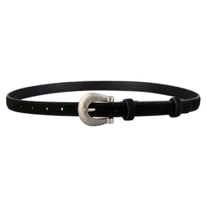 Close-up detail view of black suede leather women belt with vintage silver metal buckle.