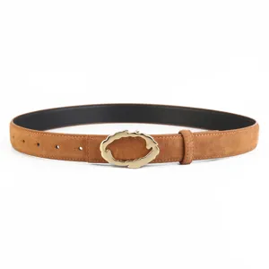 Detail view of stylish women suede leather belt featuring unique irregular gold metal buckle.