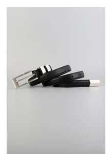 Close-up detail of black genuine leather thin belt with elegant silver square metal buckle.