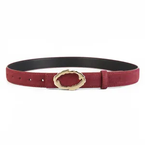 Detailed view of women's genuine leather belt featuring an elegant gold buckle design.