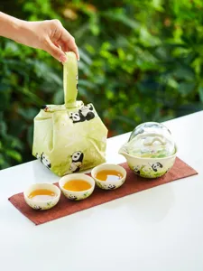 Detailed view of the panda travel tea set, featuring a portable ceramic teapot and cups.