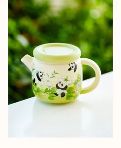 Charming ceramic tea pot featuring cute panda illustrations for single use with filter lid details.