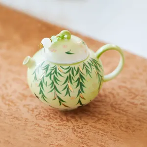 Green ceramic teapot single person Kung Fu tea pot with willow leaf and gold foil design main view